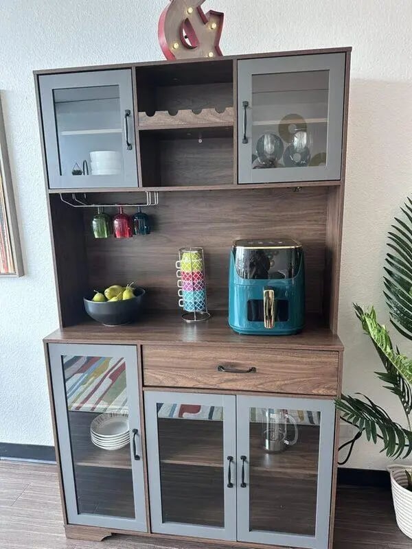 Cabinet with air fryer fruit dishes glasses kitchen cabinet. at Assembly Student Living in Denver Student Accommodation