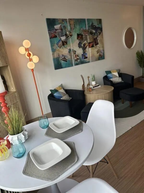 Dining table with plates glasses living room at Assembly Student Living in Denver Student Accommodation