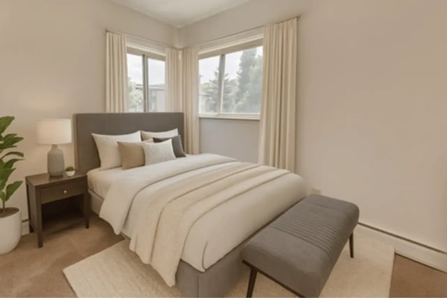 Bed with grey headboard and bench Bedroom at Cedar Street Apartments in East Lansing Student Accommodation
