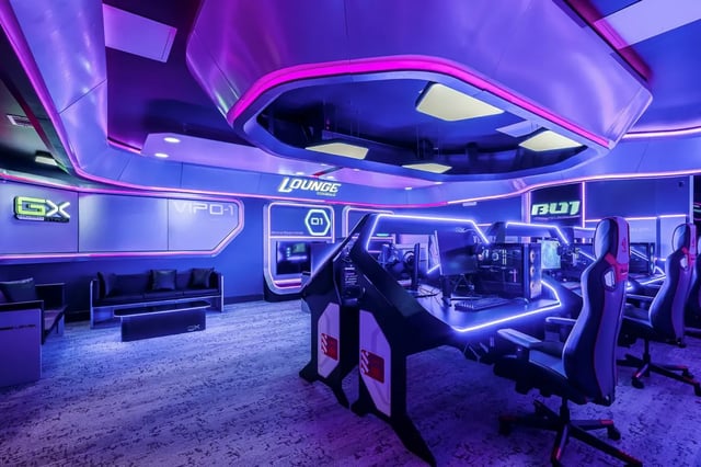 Gaming desks with chairs and lounge area lounge at Aperture in Orlando Student Accommodation