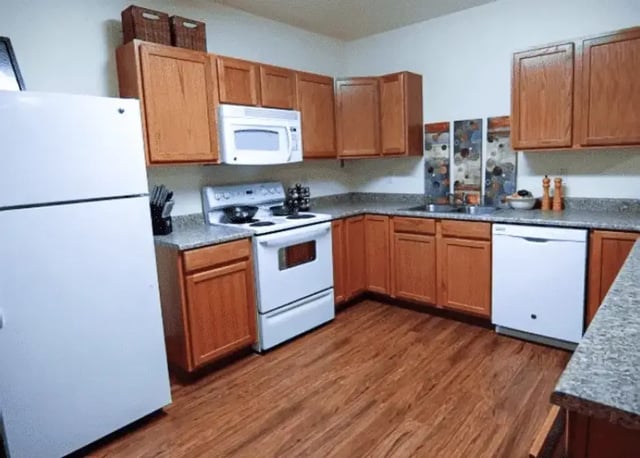 Refrigerator stove microwave dishwasher kitchen at Pinnacle Point Apartments in Rexburg Student Accommodation
