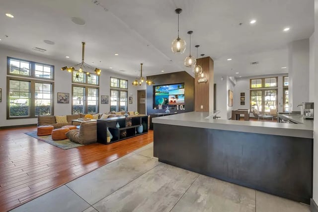 Large lounge with sectional sofa and bar living room at West 10 Apartments in Tallahassee Student Accommodation