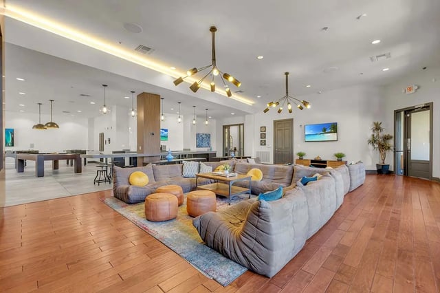 Large sectional sofa billiard tables and bar area lounge at West 10 Apartments in Tallahassee Student Accommodation