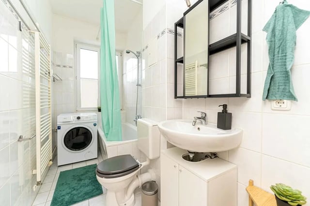 Washing machine toilet sink towel rack bathroom at Sterndamm 83.4 in Berlin Student Accommodation