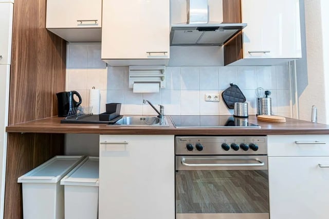 Kitchen with sink kettle oven and cabinets kitchen at Sterndamm 83.4 in Berlin Student Accommodation