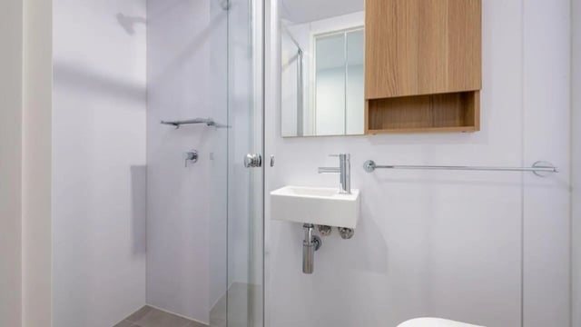 Shower sink mirrored cabinet towel rack bathroom at UniLodge Brisbane City in Brisbane Student Accommodation