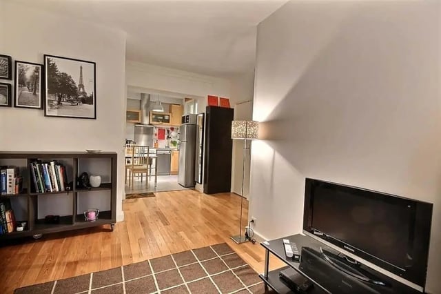 Bookshelf TV lamp kitchen and living room at Apartment in Rue Claude Terrasse, 75016 Paris, France in Paris Student Accommodation