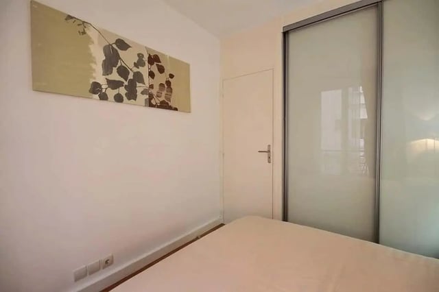 Bed painting door and closet bedroom at Apartment in Rue Claude Terrasse, 75016 Paris, France in Paris Student Accommodation