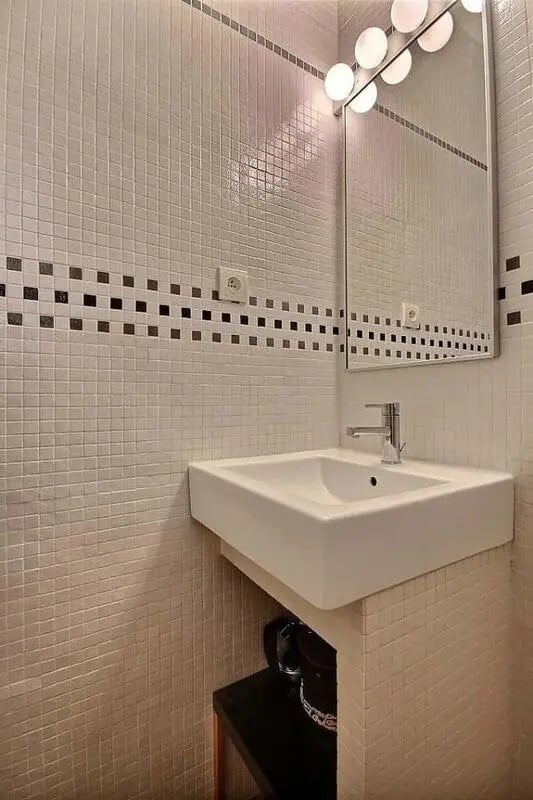 Sink with tiled wall and mirror bathroom at Apartment in Rue Claude Terrasse, 75016 Paris, France in Paris Student Accommodation