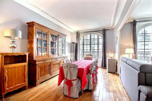 Dining table chairs cabinet and sofa living room at Apartment in Rue Damrémont, 75018 Paris, France in Paris Student Accommodation