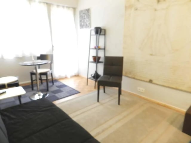 Table chairs shelf couch living room at Studio in Rue de Dantzig, 75015 Paris, France in Paris Student Accommodation