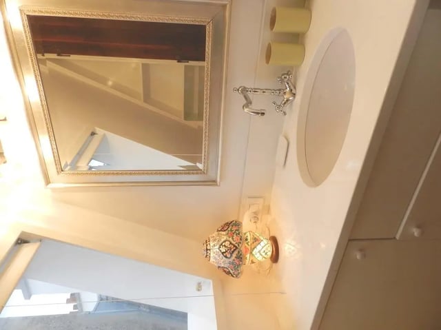 Mirror sink faucet and cups bathroom at Studio in Rue Dauphine, 75006 Paris, France in Paris Student Accommodation