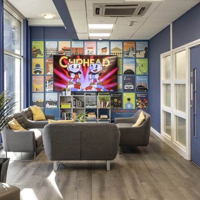 Couches and TV on colorful wall living room at Albert Court in Liverpool Student Accommodation