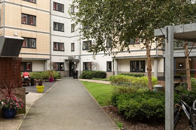 Building exterior with pathway and greenery exterior at Albert Court in Liverpool Student Accommodation