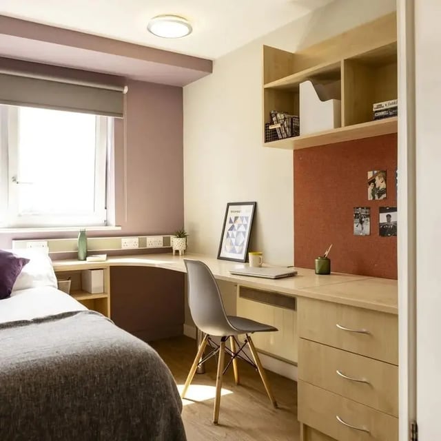 Bed desk chair shelves corkboard student accommodation bedroom at Belgrave View in Birmingham Student Accommodation