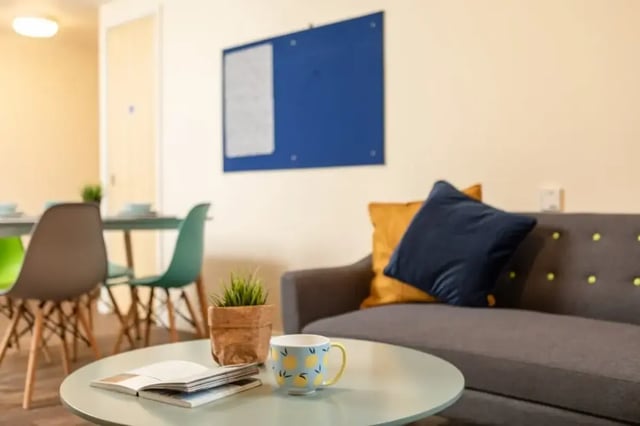 Sofa with pillows and coffee table Living room at Belgrave View in Birmingham Student Accommodation