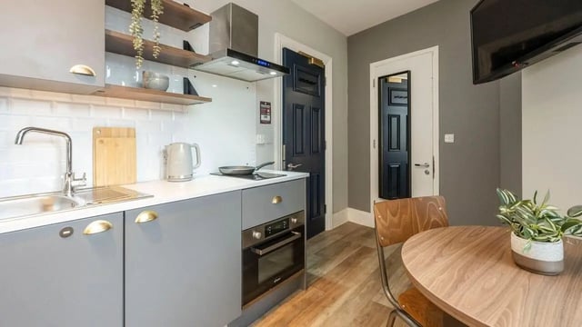 Modern grey kitchen with oven sink and table kitchen at Pavilion Court London in Wembley Student Accommodation