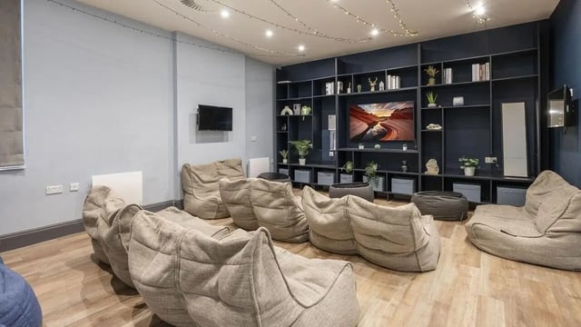 Beanbag chairs in lounge area with entertainment shelf at Chamberlain Place in Birmingham Student Accommodation