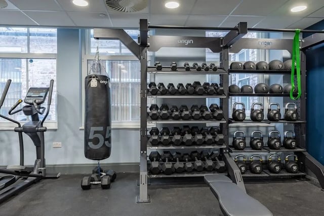 Dumbbell rack punching bag exercise machine gym room at Chamberlain Place in Birmingham Student Accommodation