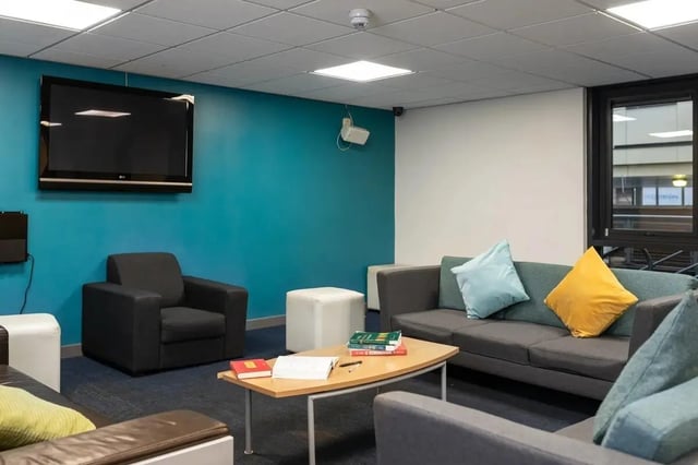 Sofa armchair coffee table TV common room at Burley Road in Leeds Student Accommodation
