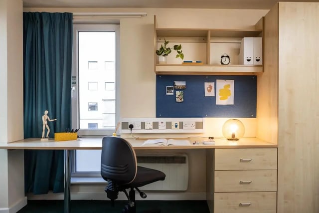 Desk chair lamp corkboard and drawers study area at Burley Road in Leeds Student Accommodation