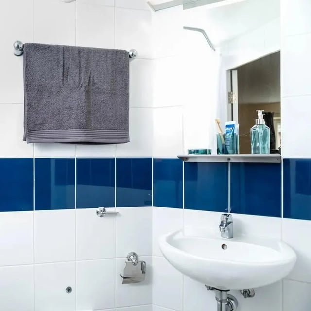 Sink towel soap dispenser and toothbrush bathroom at Burley Road in Leeds Student Accommodation