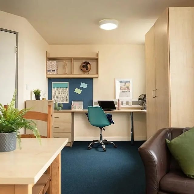 Desk chair laptop globe and closet study room at Burley Road in Leeds Student Accommodation