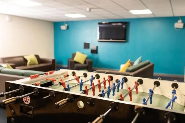 Foosball table and sofas communal area at Burley Road in Leeds Student Accommodation