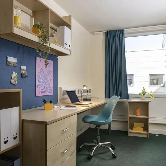 Desk with laptop and chair study area at Burley Road in Leeds Student Accommodation