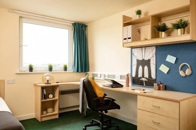 Desk with laptop chair and storage student bedroom at Burley Road in Leeds Student Accommodation