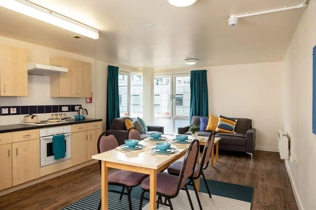 Kitchen dining living room with sofas and table at Burley Road in Leeds Student Accommodation