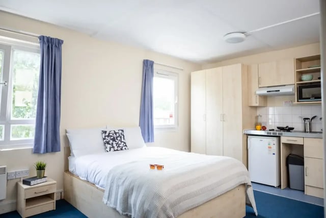 Bed small kitchen wardrobe bedroom kitchen area at Mcmillan student Village in Greenwich Student Accommodation