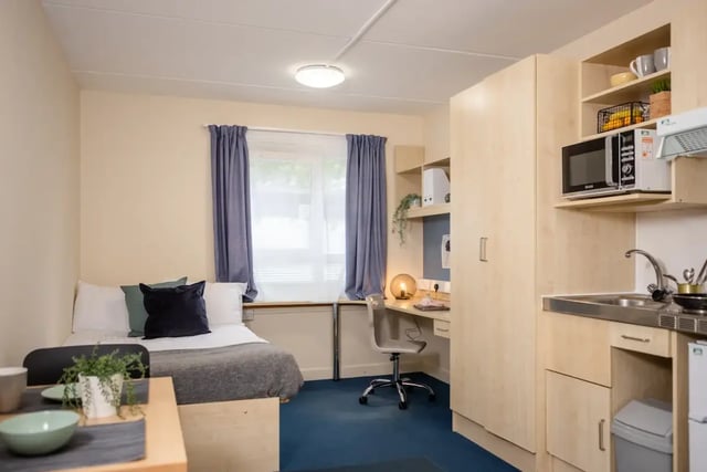 Bed desk wardrobe sink microwave kitchen living room at Mcmillan student Village in Greenwich Student Accommodation
