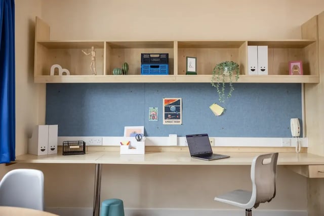 Desk with laptop shelves and blue noticeboard Study Area at Mcmillan student Village in Greenwich Student Accommodation