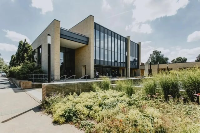 Modern building with large windows and landscaped garden exterior at Bonington Student Village in Loughborough Student Accommodation