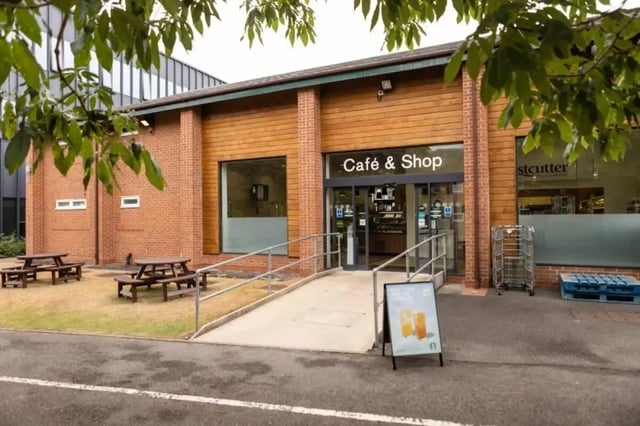 Cafe and shop exterior with picnic tables exterior at Bonington Student Village in Loughborough Student Accommodation