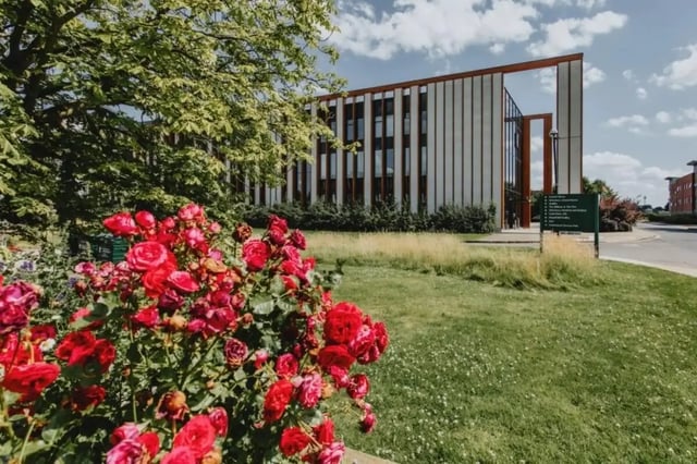 Red roses garden sign modern building exterior at Bonington Student Village in Loughborough Student Accommodation