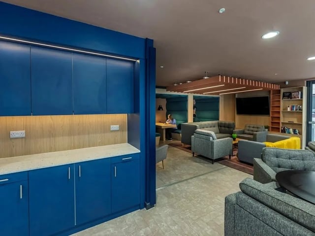 Blue cabinets lounge area with sofas and seating living room at Meadow Court in Edinburgh Student Accommodation