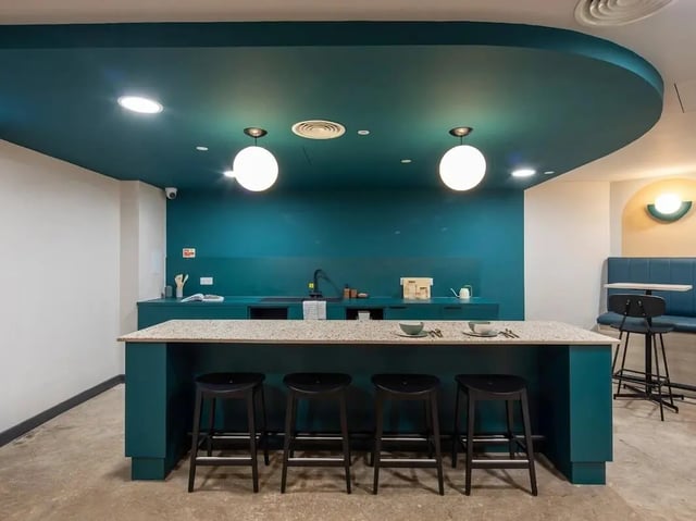 Island with stools and kitchen counter interior at Norton's Student Living in Edinburgh Student Accommodation