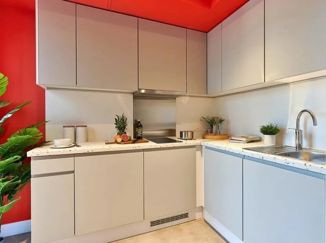 Modern kitchen with fruit, sink, and cabinets Kitchen at View Studios in London Student Accommodation