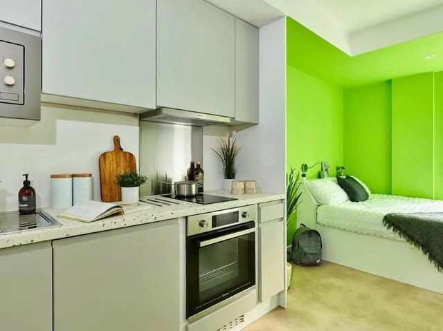 Kitchen with oven and bed bedroom at View Studios in London Student Accommodation