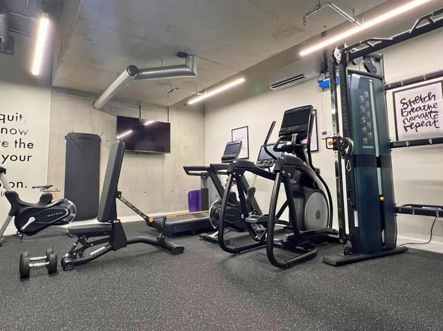 Gym equipment includes treadmill elliptical and weights gym at View Studios in London Student Accommodation