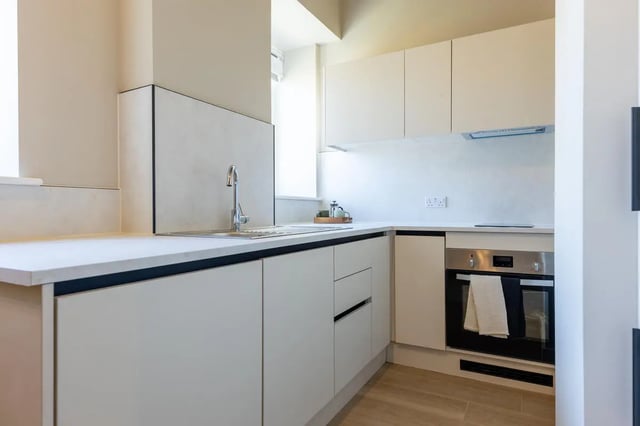 Modern white kitchen with sink and oven kitchen at Fitz and Knox in Cardiff Student Accommodation