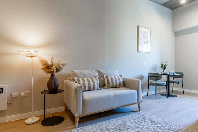 Sofa floor lamp vase dining set living room at Fitz and Knox in Cardiff Student Accommodation