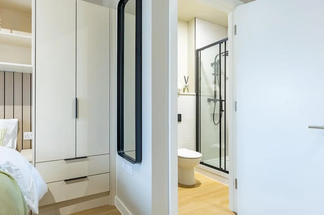 Wardrobe mirror toilet shower bathroom interior at Fitz and Knox in Cardiff Student Accommodation