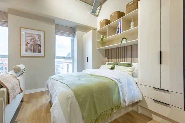 Bed with green throw and framed art bedroom at Fitz and Knox in Cardiff Student Accommodation