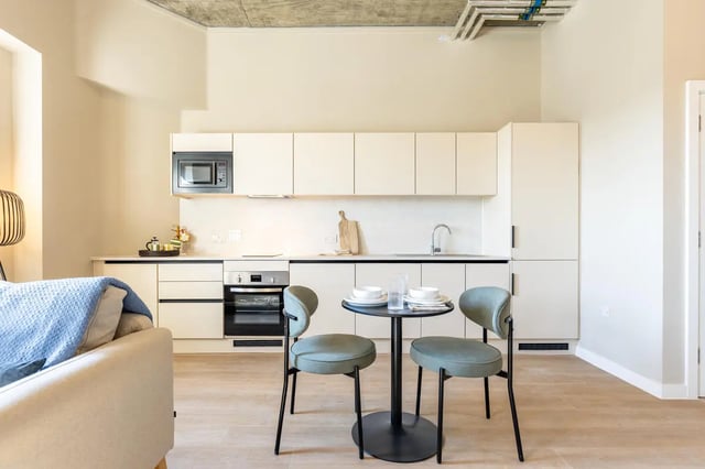 Modern kitchen with dining table and chairs kitchen at Fitz and Knox in Cardiff Student Accommodation