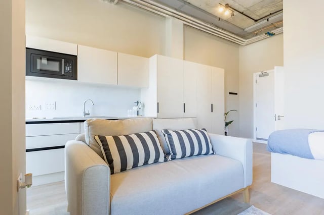 Sofa kitchen cupboards bed studio apartment at Fitz and Knox in Cardiff Student Accommodation