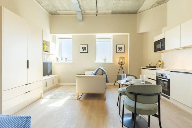 Wardrobe sofa dining table kitchen living area at Fitz and Knox in Cardiff Student Accommodation