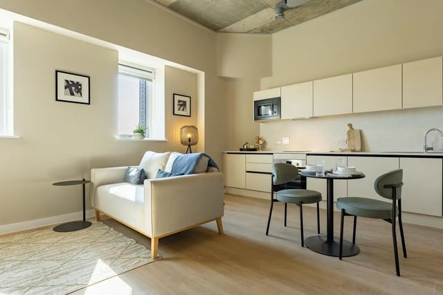 Sofa, kitchen, dining table, chairs living room kitchen at Fitz and Knox in Cardiff Student Accommodation